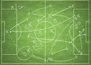 Pizarrón con tácticas de futbol